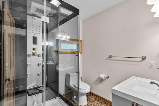 322 Clubhouse Dr, East Stroudsburg, PA 18302 - full bathroom with vanity, a shower stall, toilet, and baseboards