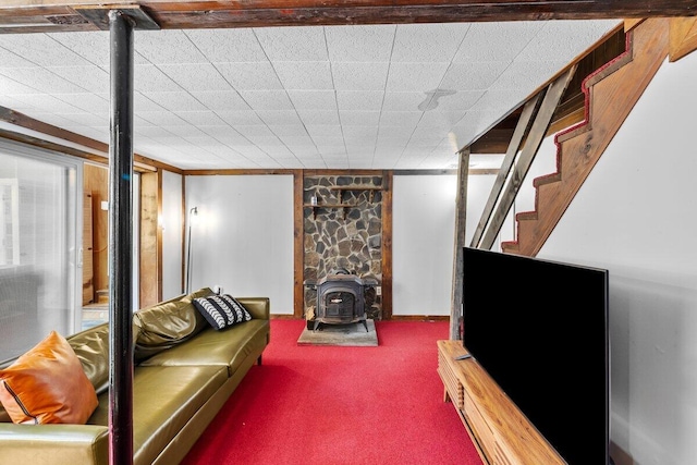 322 Clubhouse Dr, East Stroudsburg, PA 18302 - carpeted living room with a wood stove and stairs