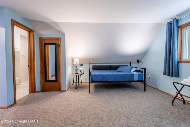 bedroom with baseboards, carpet, and vaulted ceiling