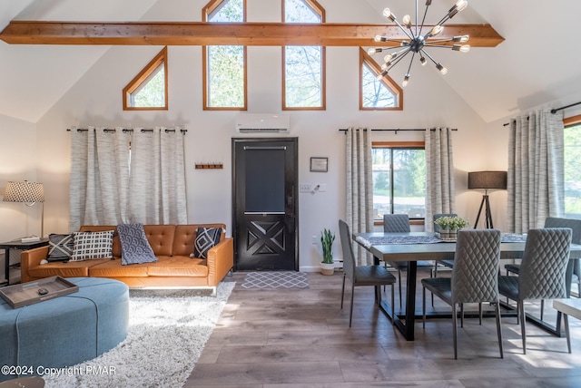 dining space featuring baseboards, wood finished floors, a notable chandelier, high vaulted ceiling, and a wall mounted AC