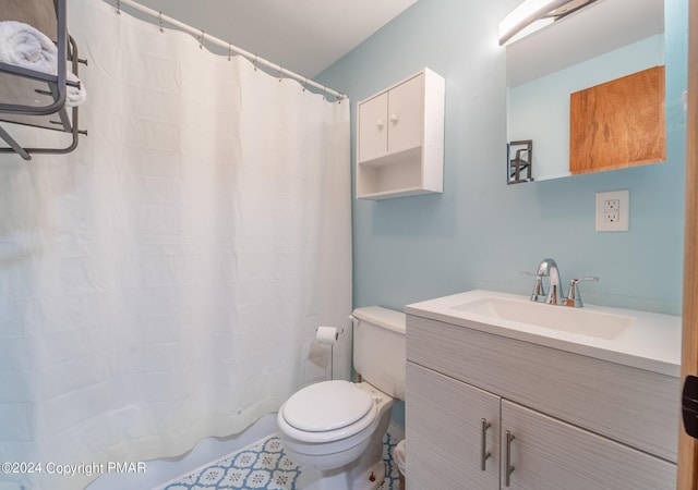 full bathroom with vanity, toilet, and a shower with curtain