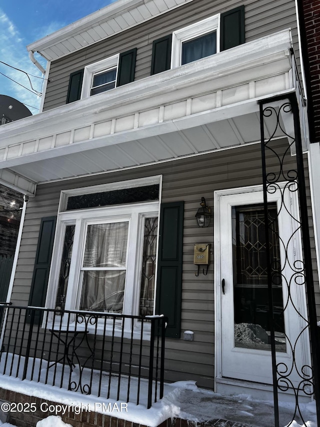 doorway to property featuring a porch