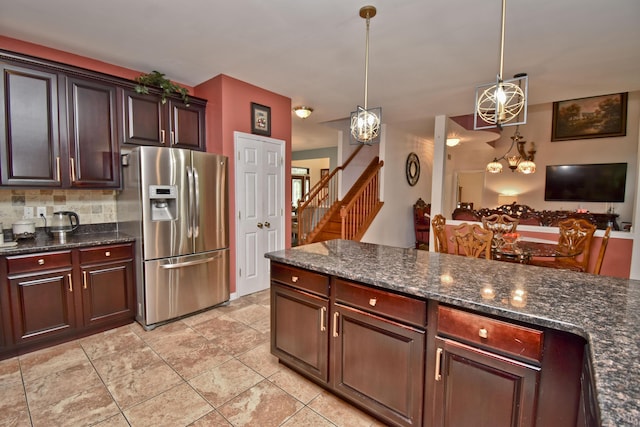 603 Washington Xing, East Stroudsburg, PA 18301 - kitchen featuring stainless steel refrigerator with ice dispenser, pendant lighting, light tile patterned flooring, decorative backsplash, and dark stone counters