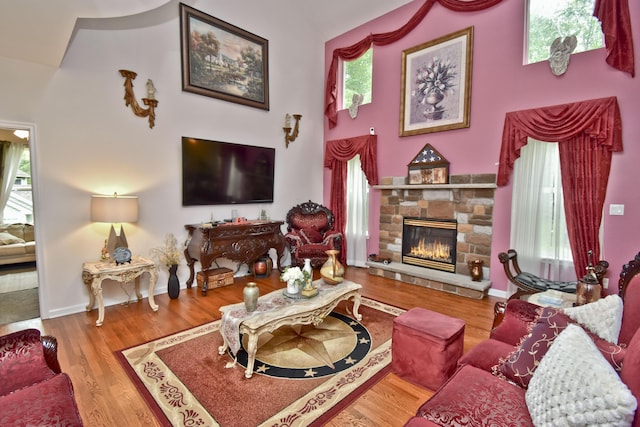 603 Washington Xing, East Stroudsburg, PA 18301 - living area with plenty of natural light, a stone fireplace, and wood finished floors
