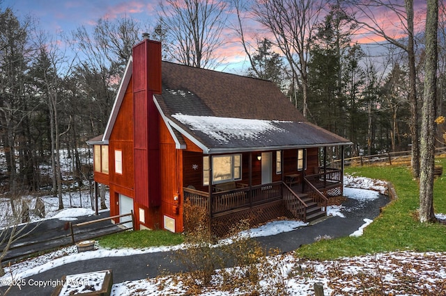 view of front facade with a garage and covered porch