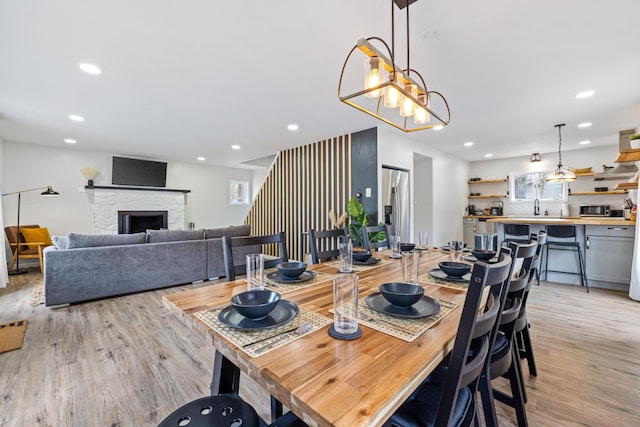 130 Sweet Briar Rd, Pocono Pines, PA 18350 - dining room featuring light wood-style flooring, recessed lighting, and a stone fireplace