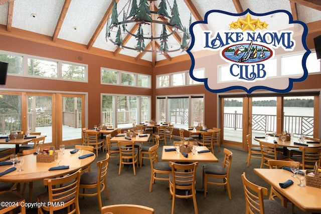 130 Sweet Briar Rd, Pocono Pines, PA 18350 - carpeted dining area featuring high vaulted ceiling, beamed ceiling, plenty of natural light, and a water view