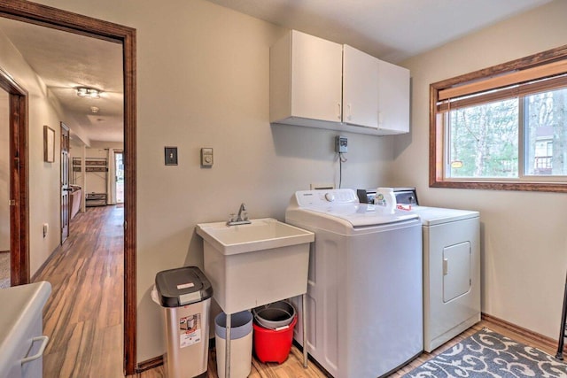54 Spencer Ln, Albrightsville, PA 18210 - washroom with cabinet space, independent washer and dryer, and light wood-type flooring