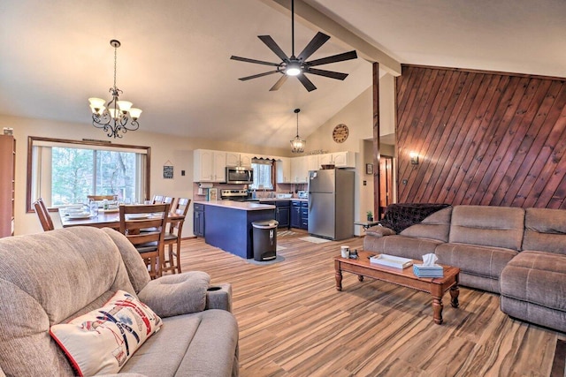54 Spencer Ln, Albrightsville, PA 18210 - living area featuring a chandelier, beam ceiling, high vaulted ceiling, light wood-type flooring, and ceiling fan