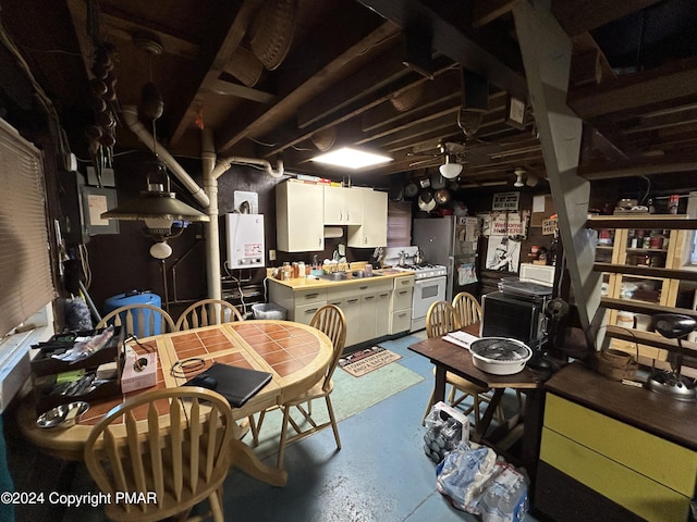 dining room with water heater and concrete floors