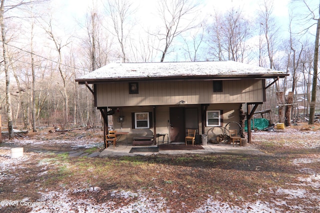 chalet / cabin with a patio area