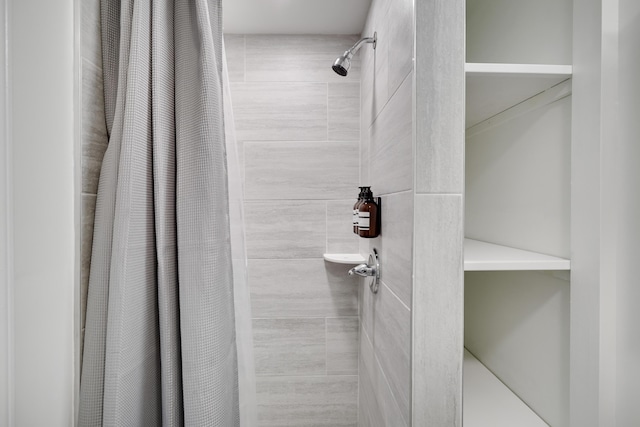 full bathroom with a tile shower