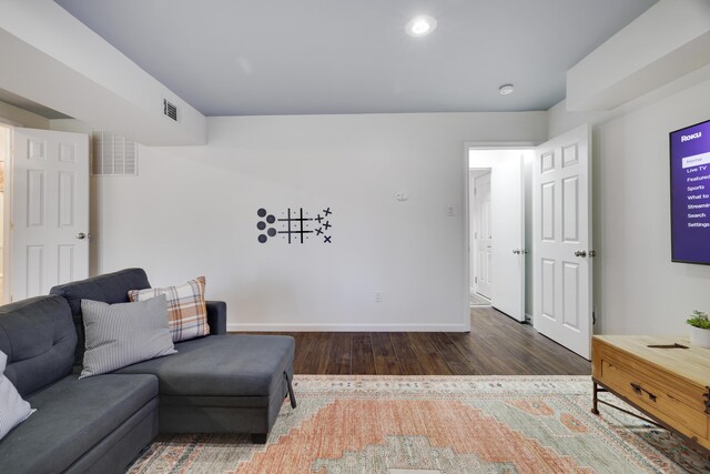 sitting room with recessed lighting, wood finished floors, visible vents, and baseboards