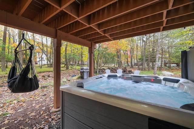 view of patio / terrace with a hot tub