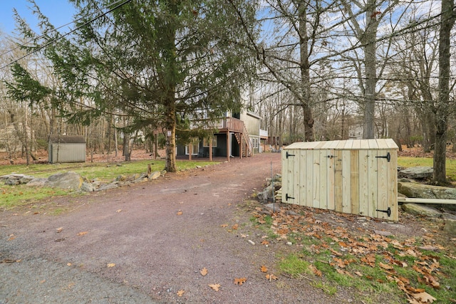 exterior space featuring stairway and driveway