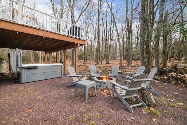 view of yard with a fire pit and a wooden deck