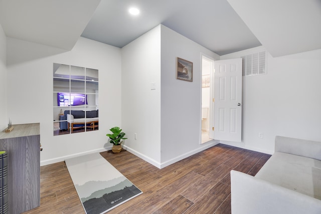 interior space with visible vents, recessed lighting, baseboards, and wood finished floors