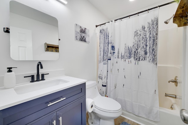 bathroom with vanity, shower / bath combination with curtain, and toilet