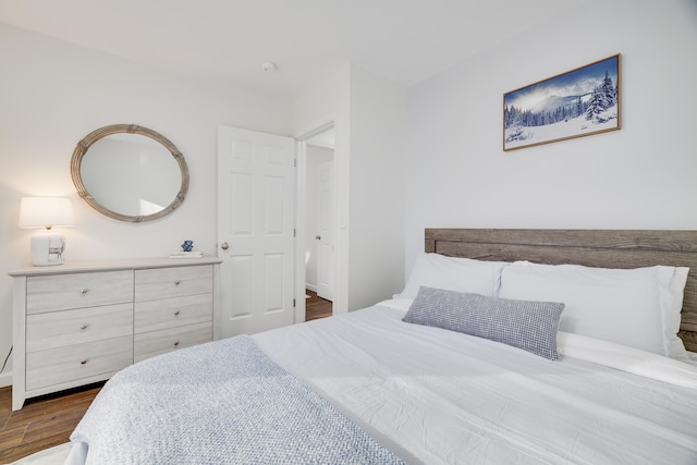 bedroom featuring dark wood-style flooring