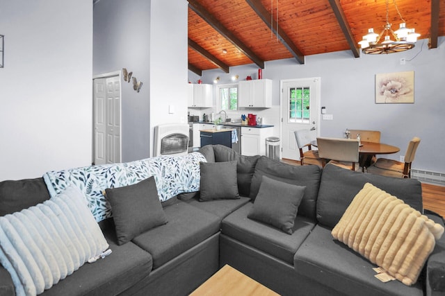 1900 Horseshoe Bnd, Tobyhanna, PA 18466 - living room with a wooden ceiling with exposed beams, a chandelier, a baseboard heating unit, wood finished floors, and high vaulted ceiling