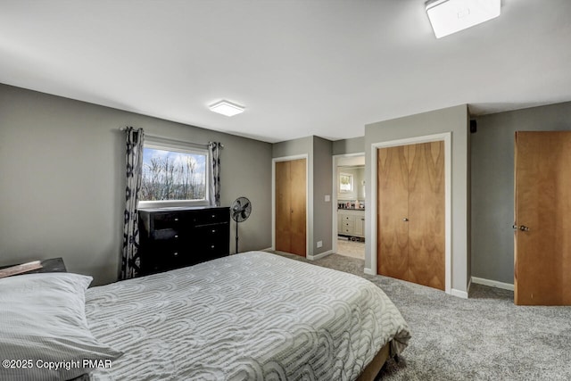 carpeted bedroom with ensuite bath