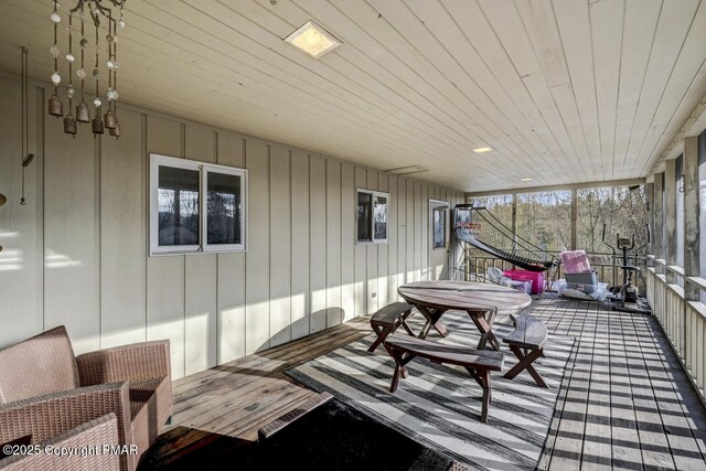 sunroom featuring wood ceiling