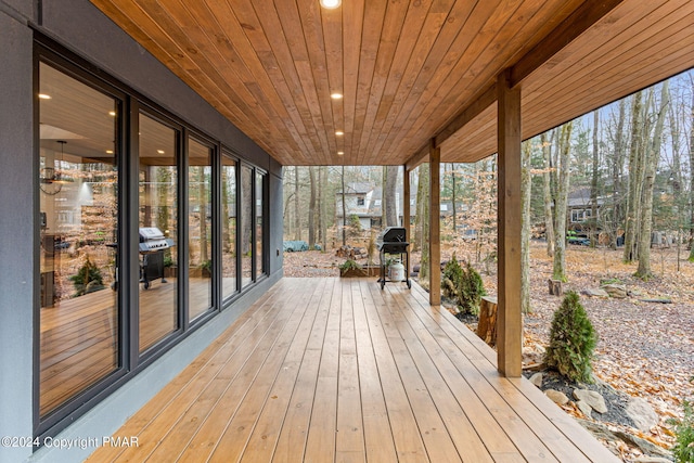 wooden terrace with area for grilling