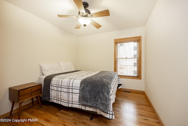1212 Acacia Dr, Hawley, PA 18428 - bedroom with visible vents, a ceiling fan, baseboards, and wood-type flooring