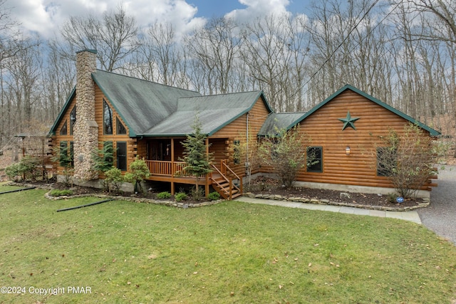1212 Acacia Dr, Hawley, PA 18428 - exterior space featuring a lawn, a porch, a shingled roof, log siding, and a chimney