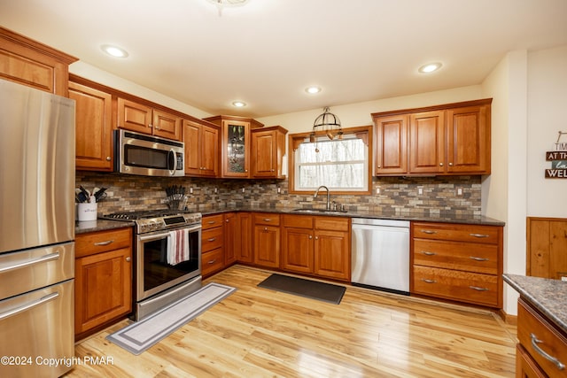 1212 Acacia Dr, Hawley, PA 18428 - kitchen featuring brown cabinets, appliances with stainless steel finishes, and a sink