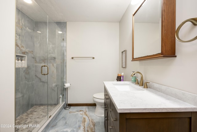 1212 Acacia Dr, Hawley, PA 18428 - bathroom featuring toilet, marble finish floor, a marble finish shower, baseboards, and vanity