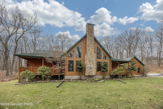 1212 Acacia Dr, Hawley, PA 18428 - rear view of house featuring log exterior, a lawn, and a chimney