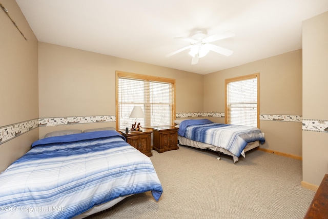 1212 Acacia Dr, Hawley, PA 18428 - bedroom with light colored carpet, a ceiling fan, and baseboards