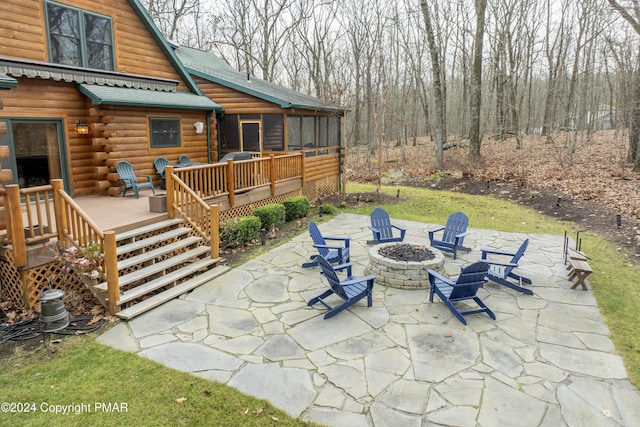 1212 Acacia Dr, Hawley, PA 18428 - view of patio with a fire pit, a deck, and a sunroom