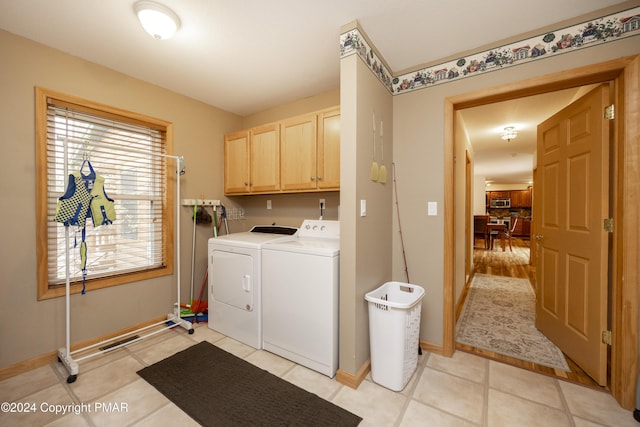 1212 Acacia Dr, Hawley, PA 18428 - laundry room with visible vents, baseboards, washing machine and dryer, light tile patterned floors, and cabinet space