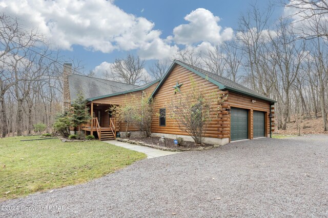 1212 Acacia Dr, Hawley, PA 18428 - view of property exterior featuring gravel driveway, log exterior, a chimney, a garage, and a yard