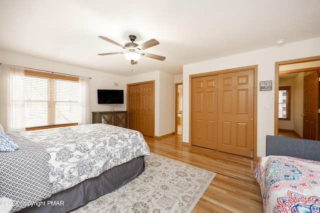 1212 Acacia Dr, Hawley, PA 18428 - bedroom featuring baseboards, multiple closets, ceiling fan, and light wood finished floors