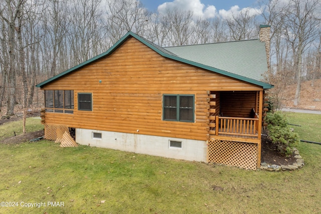 1212 Acacia Dr, Hawley, PA 18428 - view of home's exterior featuring a yard, roof with shingles, log exterior, and a chimney