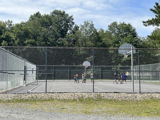 view of sport court featuring community basketball court and fence