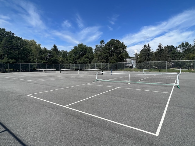 view of sport court with fence