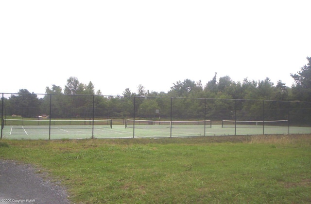 view of sport court with fence