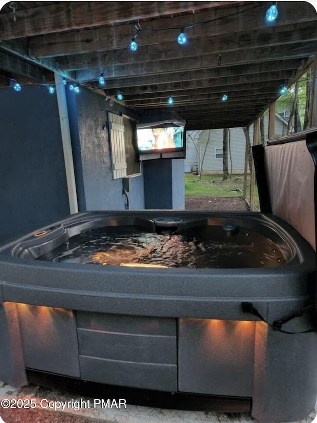 exterior space featuring a hot tub