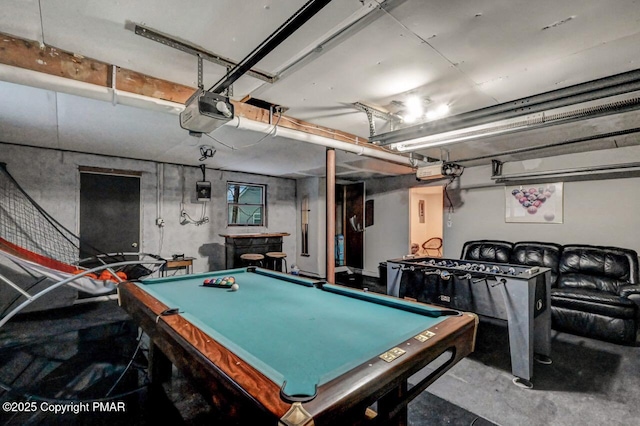 game room with pool table and concrete flooring