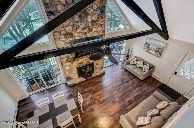 living room featuring beamed ceiling, ceiling fan, high vaulted ceiling, and hardwood / wood-style floors