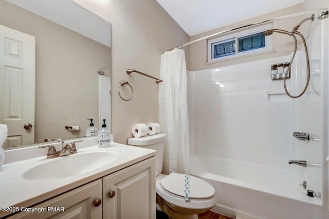 full bathroom with vanity, shower / tub combo, and toilet