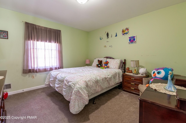 carpeted bedroom featuring visible vents and baseboards