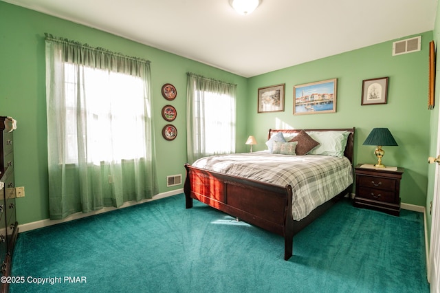 carpeted bedroom featuring baseboards and visible vents