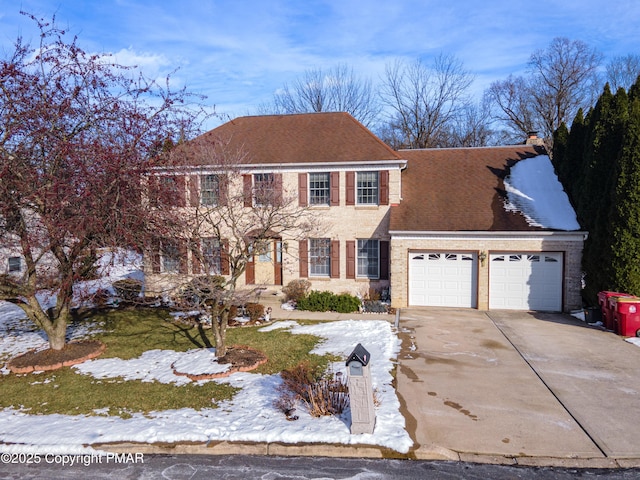 colonial-style house featuring a garage