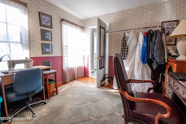 office with wainscoting and wallpapered walls