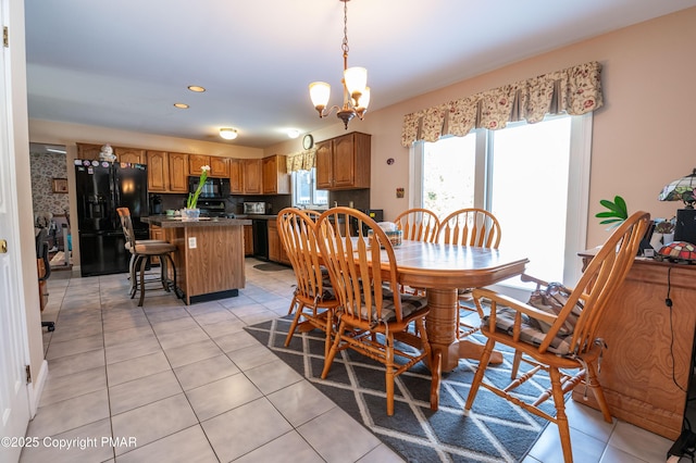 dining room with light tile patterned floors, recessed lighting, and an inviting chandelier